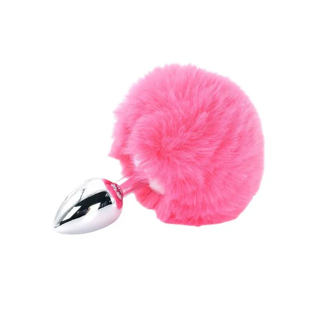 Plug anal TOYJOY Enchanting Bunnytail. din aluminiu. cu bază în formă de coadă de iepuraș. lungime 7 cm. diametru 2.6 cm. culoare roz