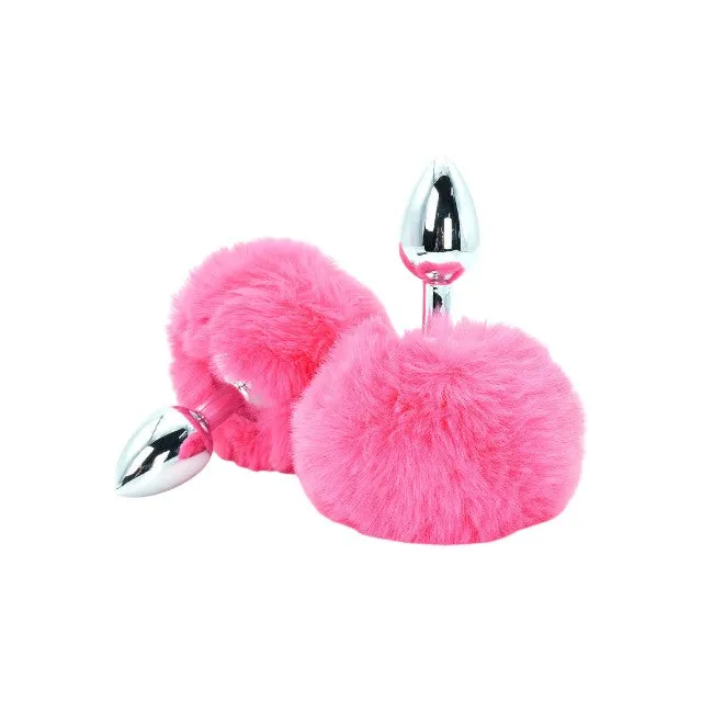 Plug anal TOYJOY Enchanting Bunnytail. din aluminiu. cu bază în formă de coadă de iepuraș. lungime 7 cm. diametru 2.6 cm. culoare roz